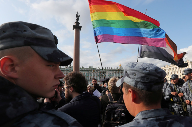 Image: Law enforcement officers block participants of the LGBT community rally \"X St.Petersburg Pride\" in central Saint Petersburg, Russia