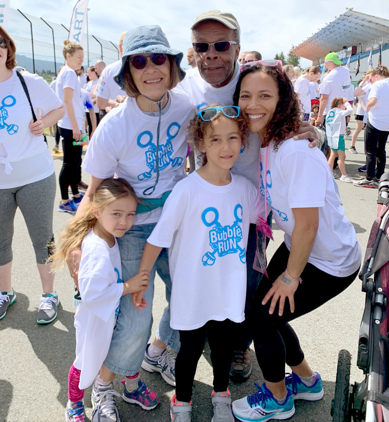 Dr. Monique Burton with her family at an event.