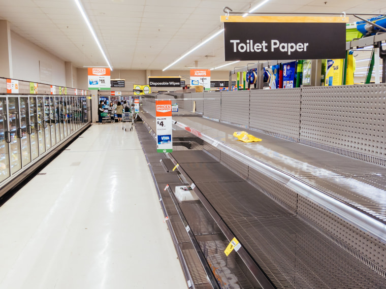 Image: Empty shelves in an Australian Woolworths supermarket after panic buying due to the Coronavirus on March 4, 2020.
