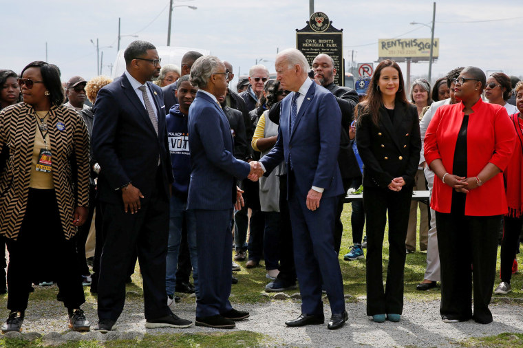 Image: Democratic U.S. presidential candidate and former U.S. Vice President Joe Biden shakes hands with Rev. Al Sharpton following a wreath laying remembrance service at Civil Rights Memorial Park in Selma