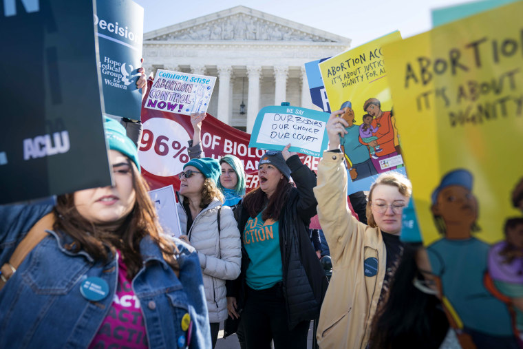 Image: Abortion rights advocates outside of the Supreme Court as the justices hear oral arguments in a Louisiana abortion case on March 4, 2020.