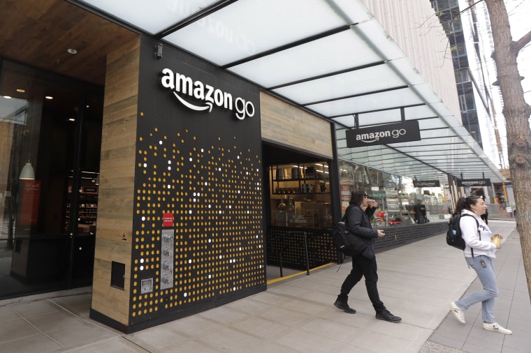 Image: People walk out of an Amazon Go store, Wednesday, March 4, 2020, in Seattle