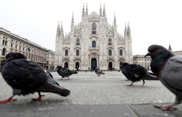 Image: Pigeons roam around Piazza Duomo square after the government decree to close cinemas, schools and urge people to work from home and not stand closer than one meter to each other, in Milan, Italy