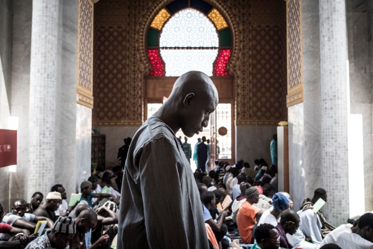 A Muslim worshipper attends a prayer against COVID-19 in Dakar on March 4, 2020, after two cases were confirmed in Senegal in the previous days.