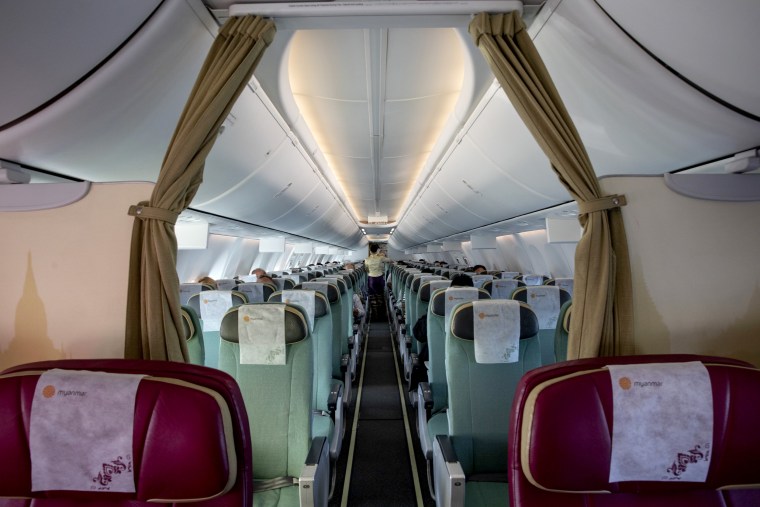 Image: A near-empty Myanmar National airlines flight from Yangon on March 4, 2020.