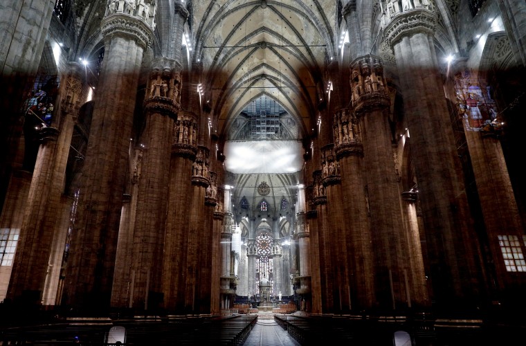 Image: Milan's Duomo sits empty after Italy's bishops cancelled masses because of the country's coronavirus outbreak on March 5, 2020.