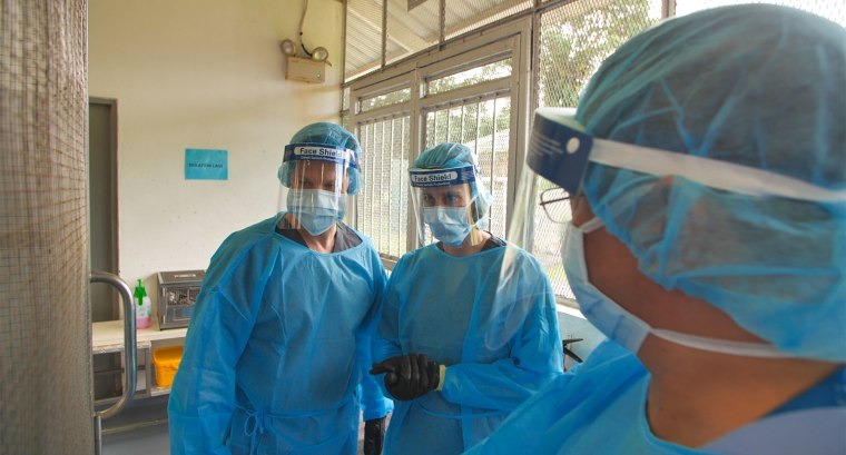 Image: Richard Engel with Dr. Danielle Anderson, Scientific Director of the Duke-NUS Medical School ABSL3 laboratory, in an animal research lab in Singapore