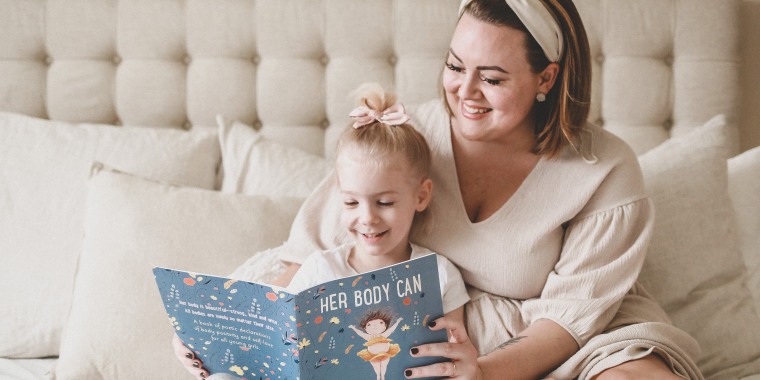 Katie Crenshaw, pictured here with her daughter, co-authored "Her Body Can," a body positive children's book for kids ages 8 and under.