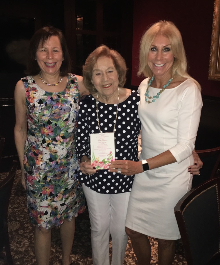 Glassman at her 90th birthday party with her two daughters.