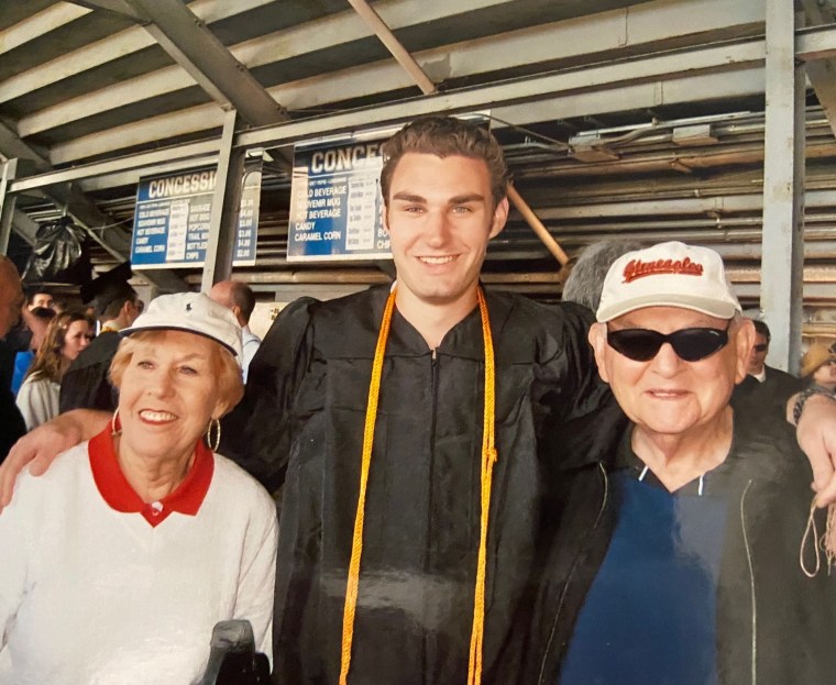 Glassman, left, with Zach at his college graduation in 2009.
