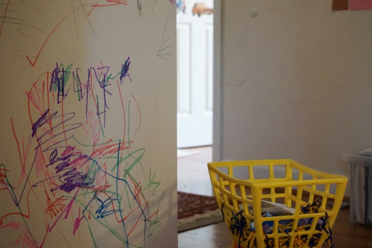 The O'Neills allowed their children to draw on the walls during their 726 days of isolation. Making the best of the situation helped them cope with it. 