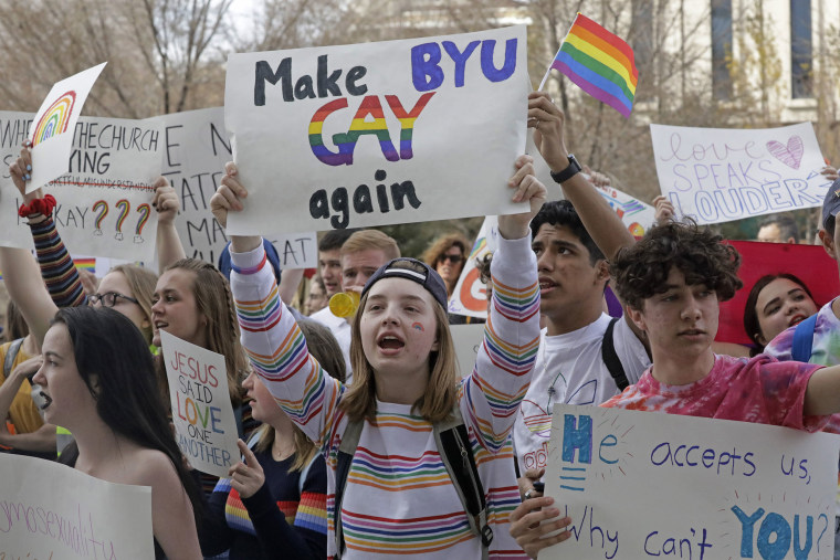 Image: Brigham Young University student Kate Lunnen joins several hundred students protesting near The Church of Jesus Christ of Latter Day Saints church headquarters