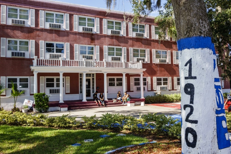 Image: Students sit outside Flora B. Curtis Hall at Bethune-Cookman University in Daytona Beach, Fla.