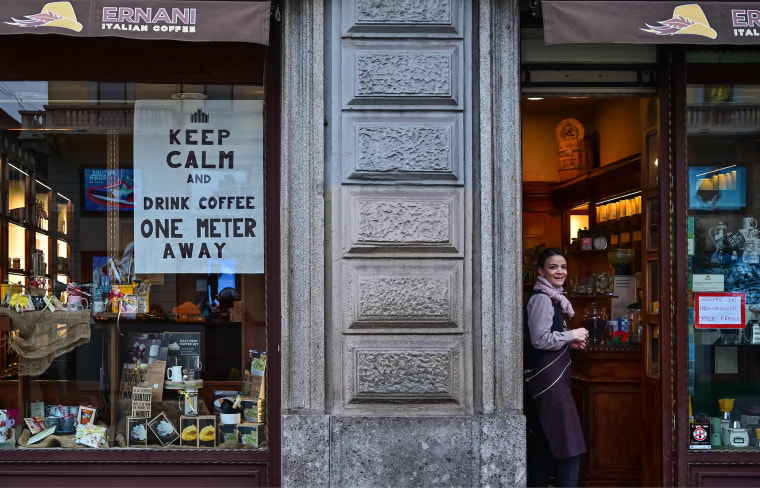 Image: A waitress in downtown Milan