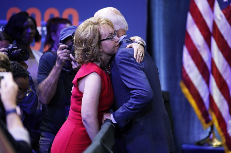 Joe Biden, right, hugs former Rep. Gabby Giffords during a gun safety forum on Oct. 2, 2019, in Las Vegas.