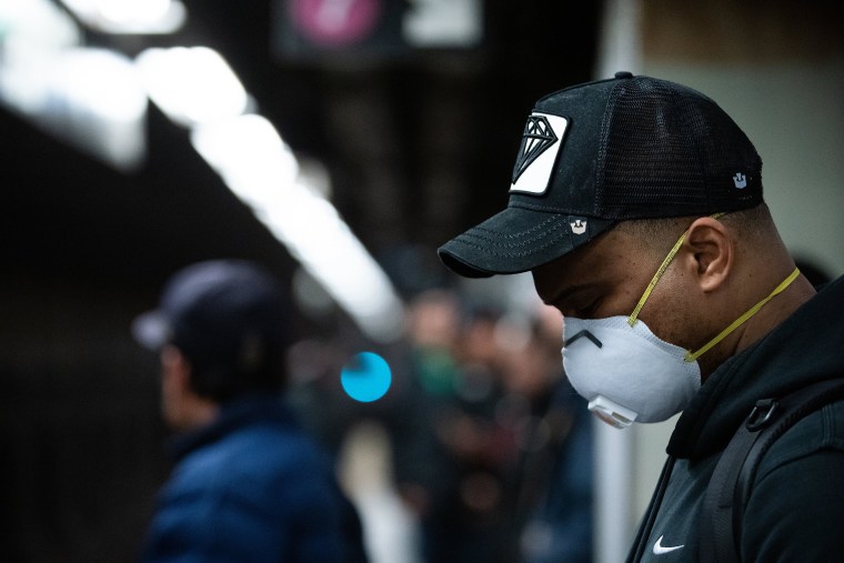 Image: A man wearing a protective mask is seen on the subway on March 10, 2020 in New York City.