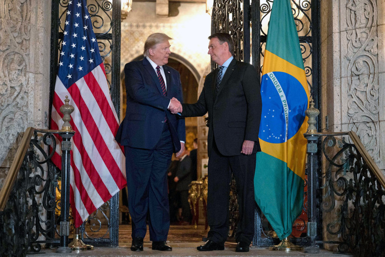Image: President Donald Trump with Brazilian President Jair Bolsonaro at Mar-a-Lago in Palm Beach, Fla,