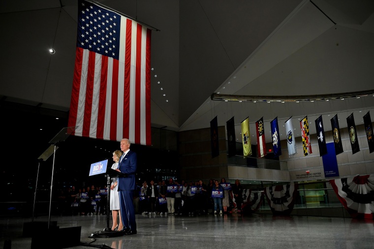 Joe Biden, flanked by his wife Jill Biden, speaks at the National Constitution Center in Philadelphia on March 10, 2020.