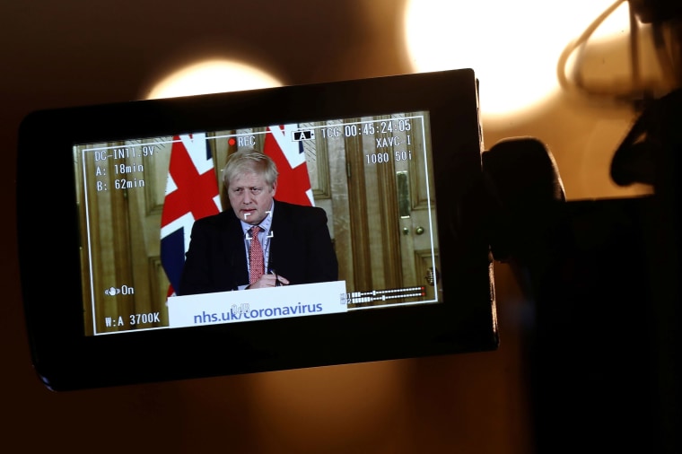 Image: A camera filming Britain's Prime Minister Boris Johnson