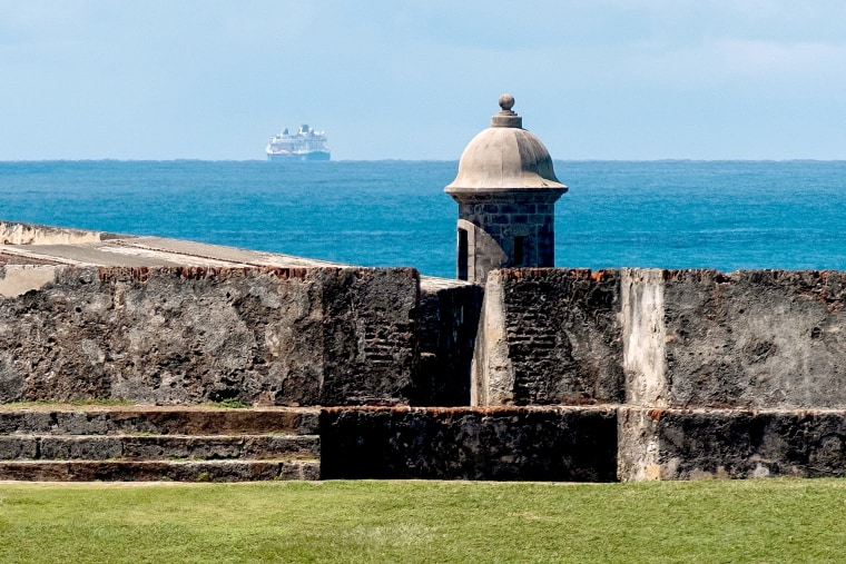 Image: The Celebrity Summit cruise ship, carrying 2,000 passengers, is held off the coast of San Juan, Puerto Rico, on March 14, 2020.