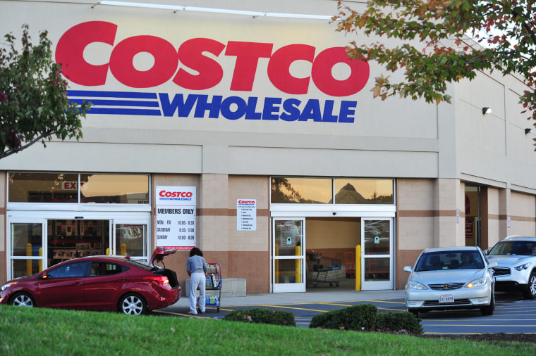 Image: A shopper loads items into her car after shopping at Costco Wholesale Club in Manassas, Virginia
