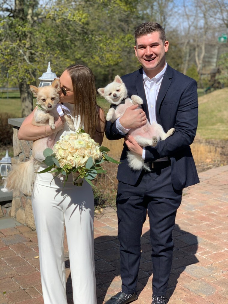 The newlyweds brought their adorable dogs along for their small ceremony.