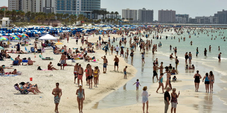 Image: FILE PHOTO: People crowd the beach, while other jurisdictions had already closed theirs in efforts to combat the spread of novel coronavirus disease (COVID-19) in Clearwater