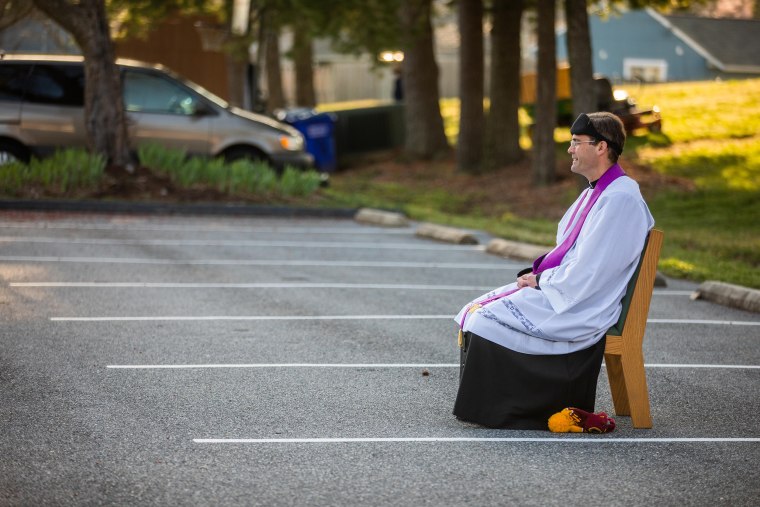 Father Holmer says that only rain will stop him from setting up to hear confessions in the church parking lot. 