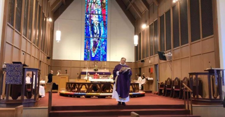 The Rev. Canon James D. Shoucair, rector of Christ Episcopal Church, in Pittsburgh leads a small congregation in the last service. The church is halting in-person worship to do its part to slow the spread of COVID-19 by offering streaming services. 