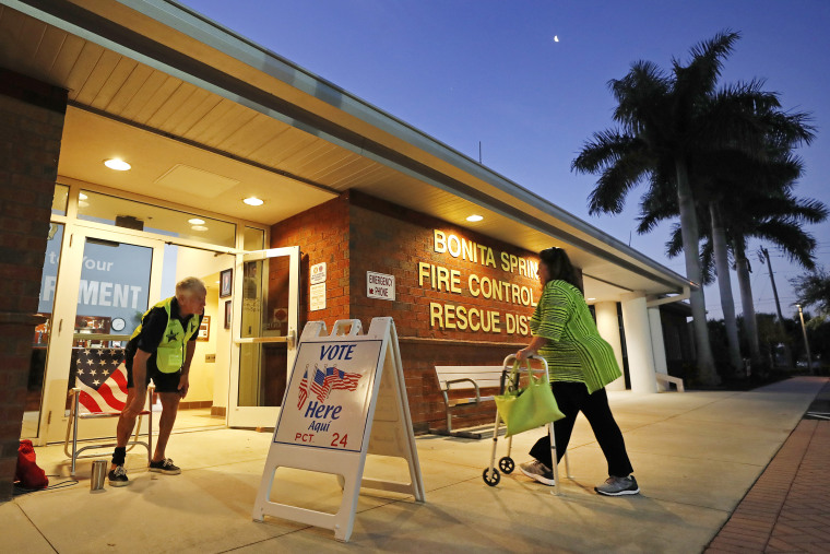 A voter walks into a polling station for the Florida presidential primary, Tuesday, March 17, 2020, in Bonita Springs, Fla.