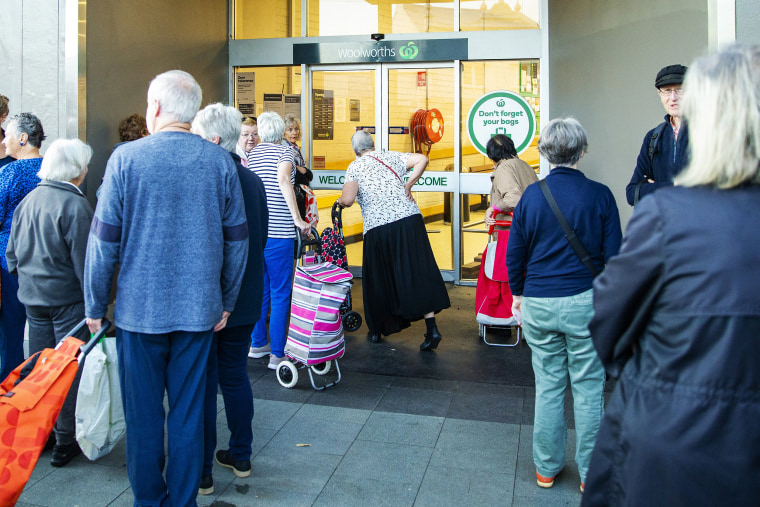 Image: Elderly customers waiting for the opening of Woolworths supermarket in Balmain on March 17, 2020 in Sydney, Australia.