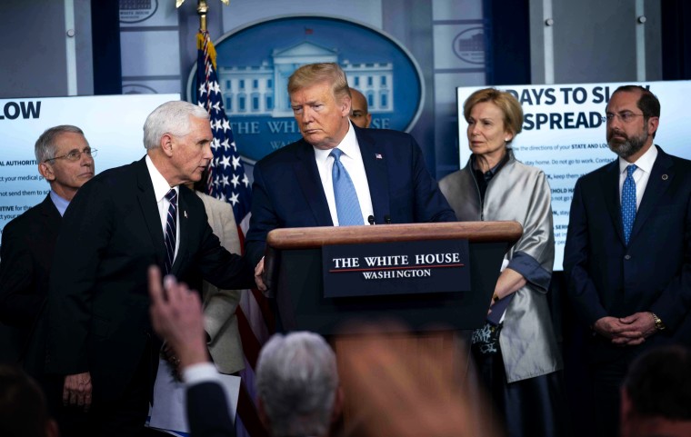 Image: President Donald Trump listens to Vice President Mike Pence during a press conference on the coronavirus at the White House on March 16, 2020.