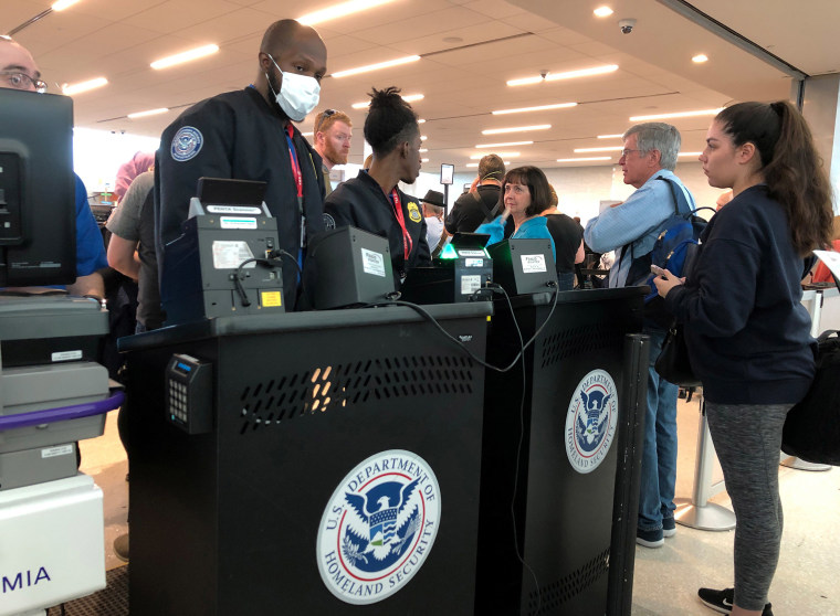 Image: A U.S. Department of Homeland Security officer wears a protective face mask in Fort Lauderdale
