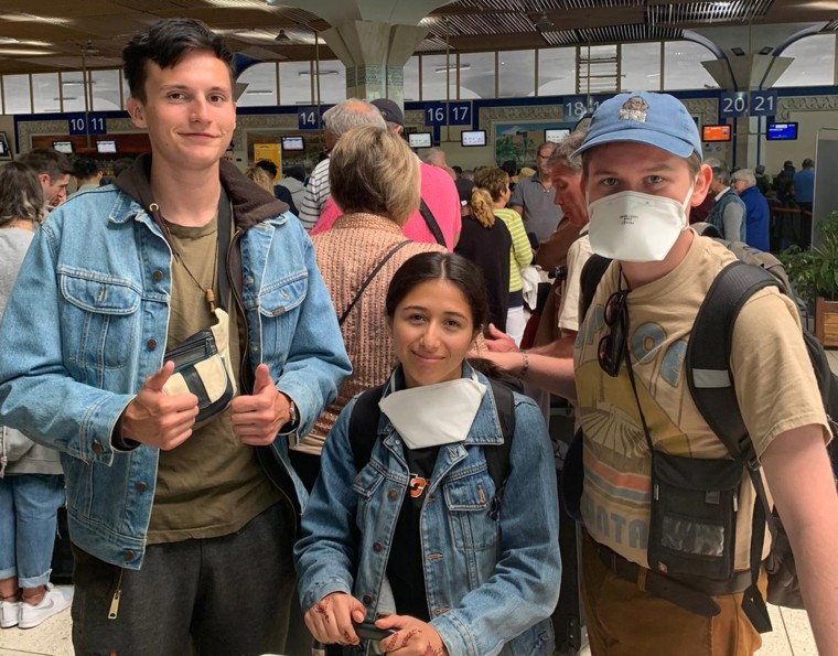 Image: From left, Alex Walsh, Genevieve Serna and Jacob Muscarella at Agadir airport in Morocco on Wednesday hoping to board a flight back to the U.S.