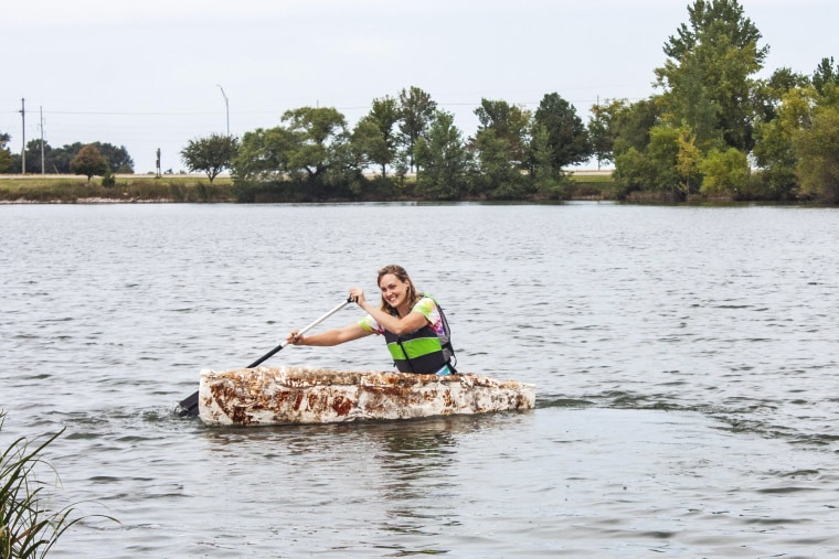Katy Ayers paddles her canoe on a Nebraska lake.