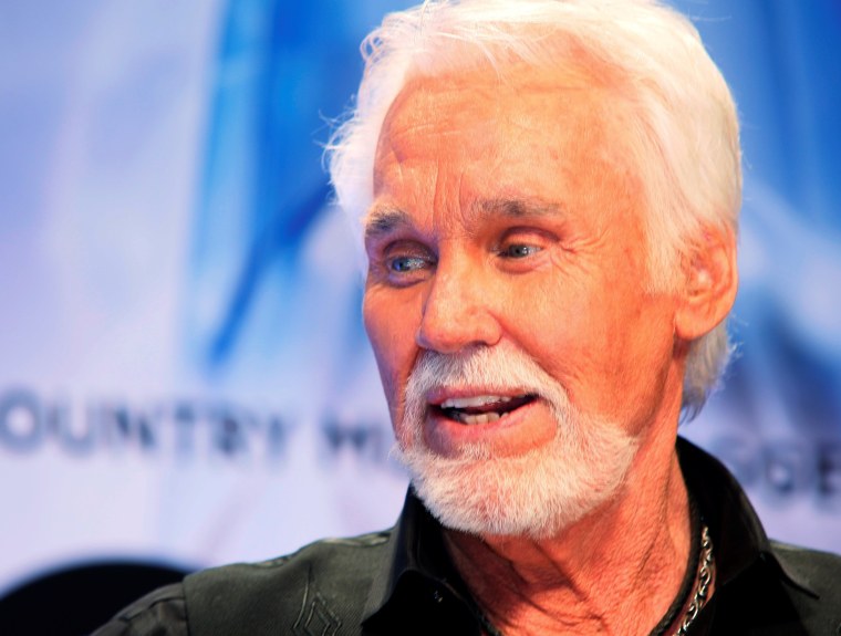 Image: FILE PHOTO: Kenny Rogers poses backstage after accepting the Willie Nelson Lifetime Achievement award at the 47th Country Music Association Awards in Nashville