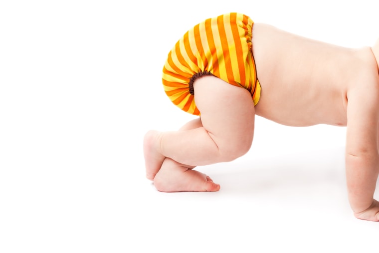 Crawling baby lifting cloth diaper high up