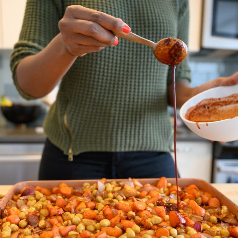 "Smells like home," said Hassan as she drizzled the sauce over the vegetables.