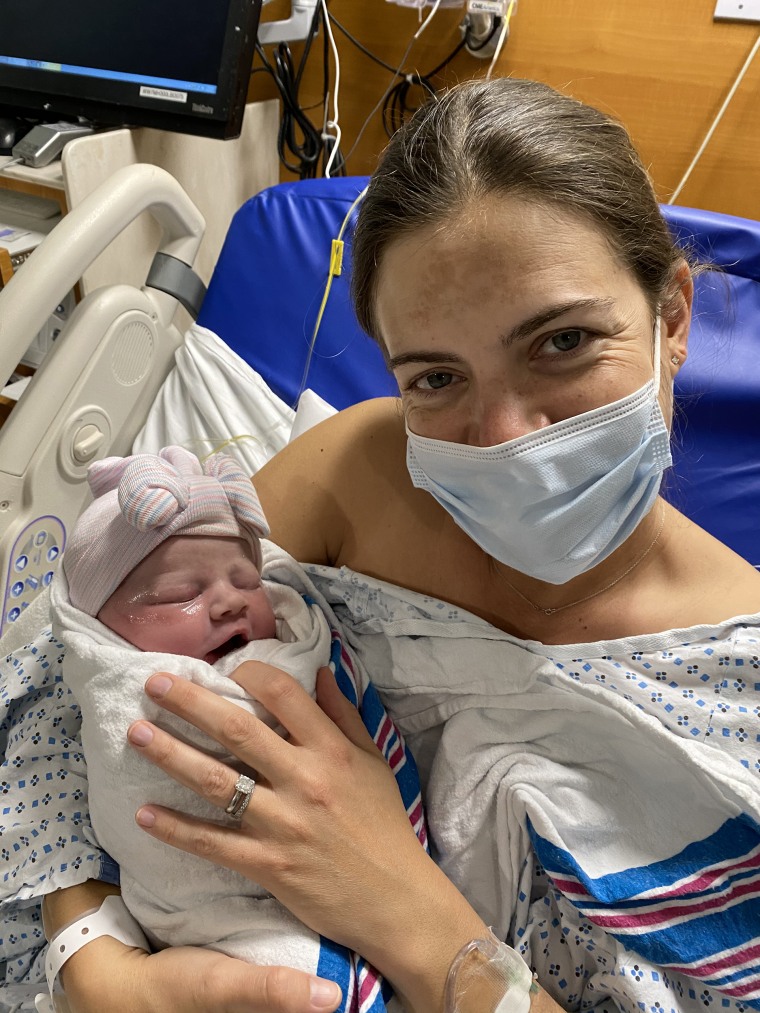 newborn baby girl in hospital with mom