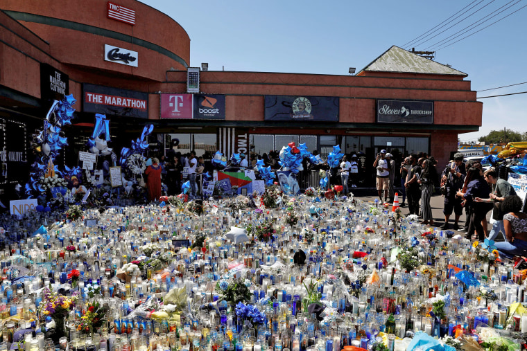 Image: People mourn the shooting death of musician Nipsey Hussle outside of The Marathon Clothing store on Slauson Avenue in Los Angeles