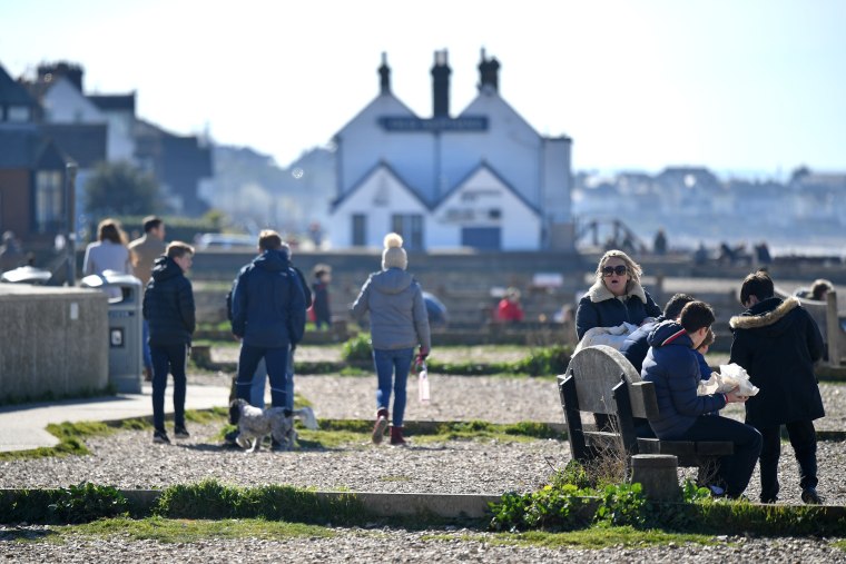 Image: People gathered on Sunday at the seafront in Whitstable, east of London, despite requests for social distancing from the government.