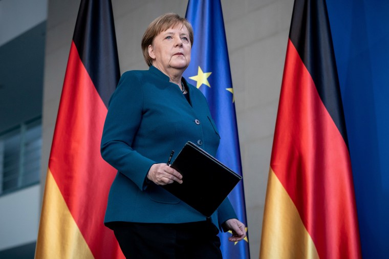 Image: German Chancellor Angela Merkel arrives for a media statement on the spread of coronavirus at the Chancellery in Berlin, Germany