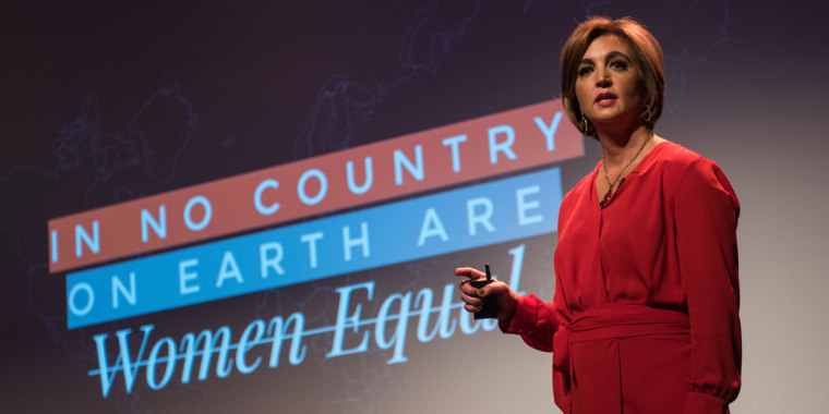 Gender economist Katica Roy presenting on stage.