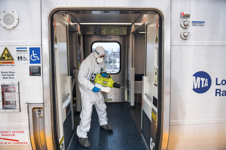 Image: Worker disinfects LIRR train during Covid-19 pandemic