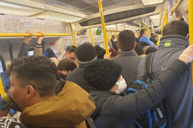 Image: Commuters squeeze into an Underground train in London on Tuesday morning.