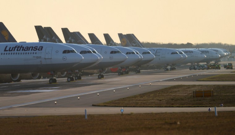 Image: Lufthansa planes stand on a closed runway in Frankfurt, Germany on Tuesday.