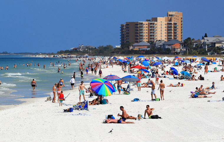 Image: People visit Clearwater Beach during the coronavirus (COVID-19) pandemic March 20, 2020 in Clearwater, Florida.