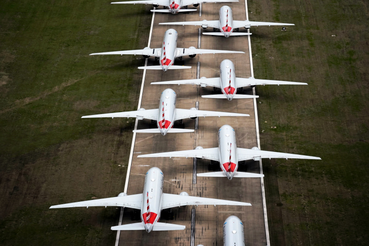 Image: American Airlines planes parked on a runway after flight reductions in response to the spread of coronavirus at Tulsa International Airport in Oklahoma on March 23, 2020.