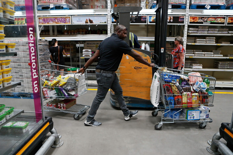 Image: A customer pushes two shopping carts filled with food while shopping at Makro in Pretoria East, South Africa