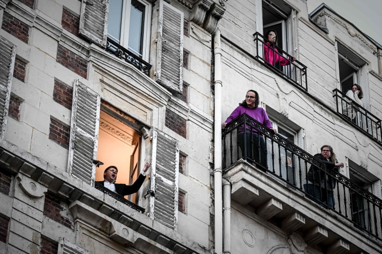 Image: An opera singer performs "O sole mio" for his neighbors in Paris on Thursday.